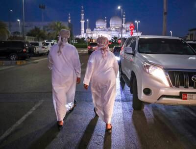 Worshippers leave Ibn Taymiyyah Mosque in Abu Dhabi, close to the Sheikh Zayed Grand Mosque, after evening prayers on the day the death of President Sheikh Khalifa was announced. Victor Besa / The National.