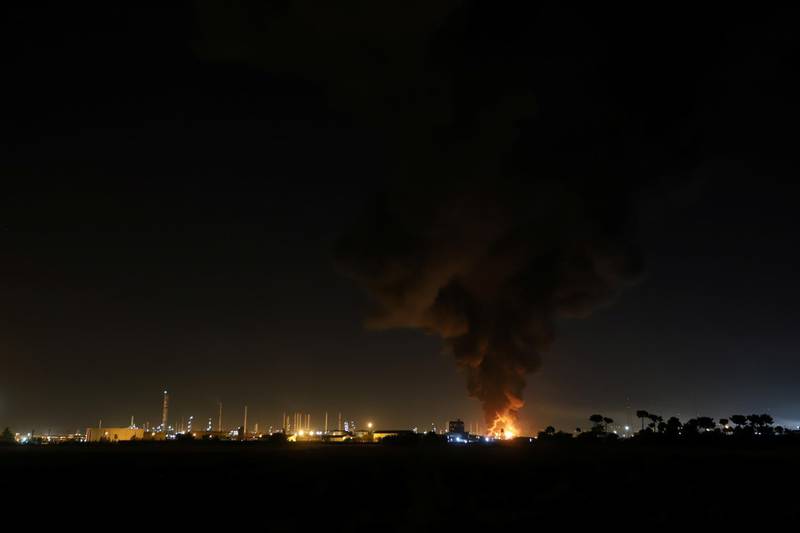 Smoke rises at an oil refinery in Tehran. Reuters