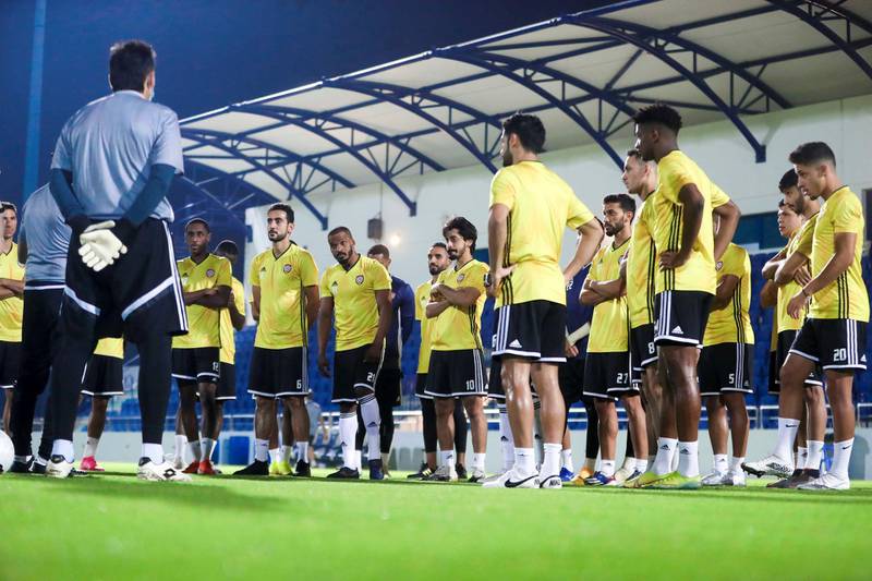 UAE players listen to manager Jorge Luis Pinto during the training session in Dubai.