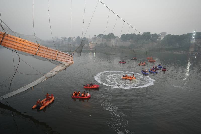 Search and rescue work in progress after a cable suspension bridge collapse in Morbi, Gujarat state, India. AP