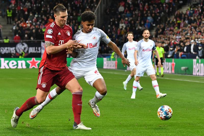 Bayern Munich's Niklas Suele and Salzburg's Karim Adeyemi battle for the ball during the Champions League last-16, first-leg clash. AFP