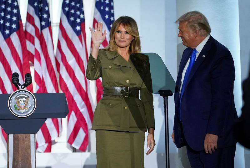 U.S. first lady Melania Trump waves as she is joined by U.S. President Donald Trump after delivering her live address to the largely virtual 2020 Republican National Convention from the Rose Garden of the White House in Washington, U.S., August 25, 2020. REUTERS/Kevin Lamarque