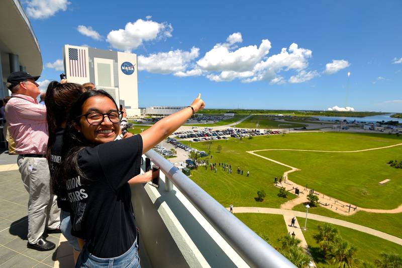 Al Mansoori watches a SpaceX Falcon 9 rocket launch from Kennedy Space Center carrying her Genes in Space experiment to the International Space Station on Aug. 14, 2017 in {town}, Florida. (Scott A. Miller for The National)