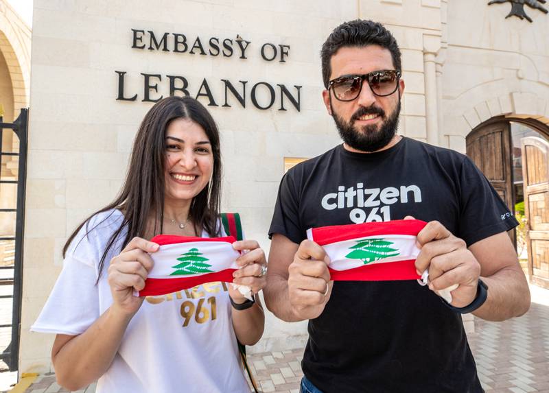 Nadine Abou Ghali and Rabah Sakr after casting their votes at the Embassy of Lebanon in Abu Dhabi. Victor Besa / The National