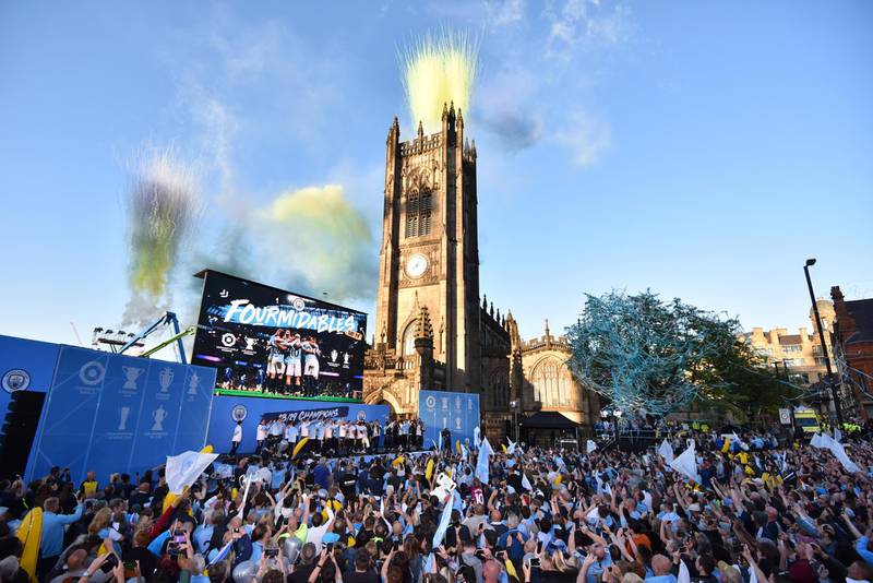General view as players celebrate on the stage and fans show their support during the Manchester City Teams Celebration Parade in Manchester, England. Getty Images