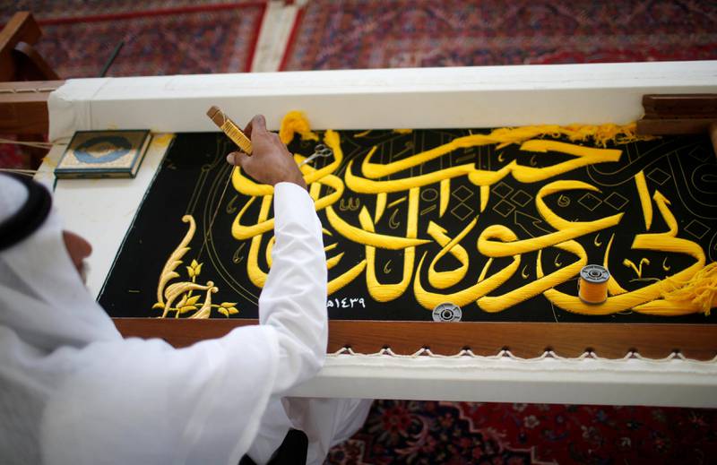 A man embroiders the Kiswa, a silk cloth covering the Holy Kaaba, ahead of the annual haj pilgrimage, at a factory in the holy city of Mecca, Saudi Arabia August 26, 2017. Picture taken August 26, 2017. REUTERS/Suhaib Salem