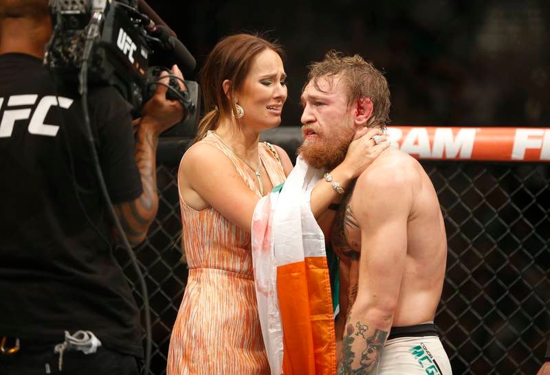 Conor McGregor celebrates with girlfriend Dee Devlin after defeating Chad Mendes during their interim featherweight title mixed martial arts bout at UFC 189 on  July 11, 2015, in Las Vegas.