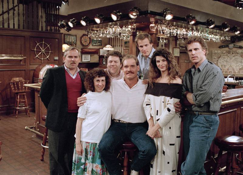 Boston Red Sox third baseman Wade Boggs, centre,  with the cast of Cheers in 1988 during rehearsal for an episode in which he appears. AP Photo