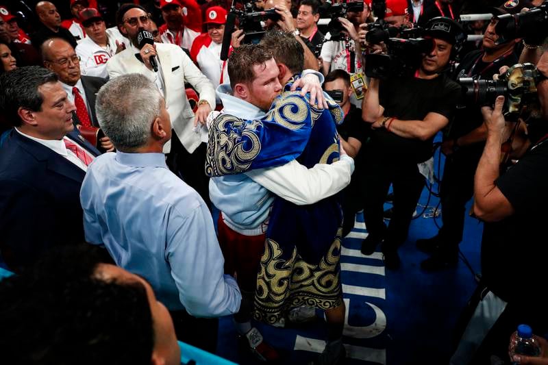 Saul Alvarez and Gennady Golovkin embrace in the ring after after their fight at the T-Mobile Arena. EPA