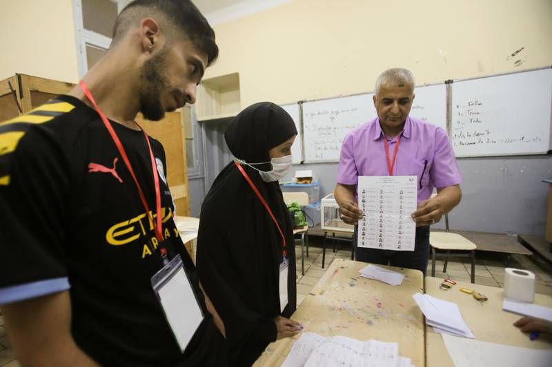 Election workers count ballots at the end of voting in the parliamentary election in Algiers. Reuters