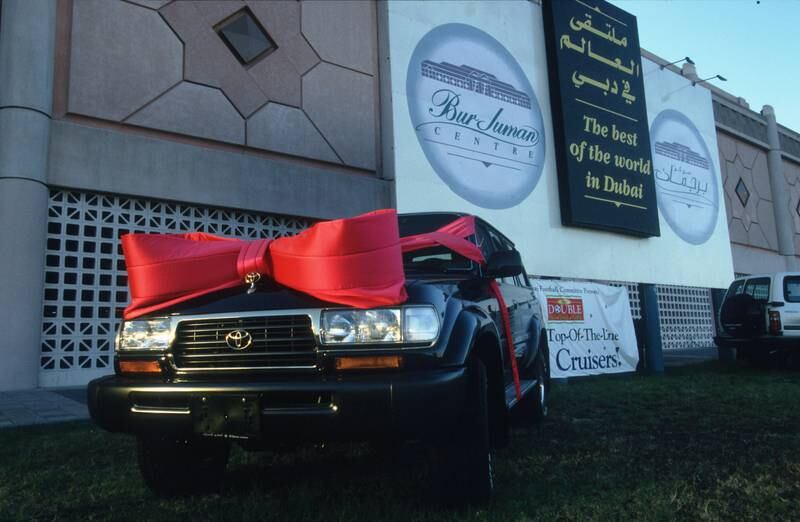 A vehicles wrapped like a Christmas gift in front of Dubai's Burjuman shopping centre, in December 1996. Getty Images