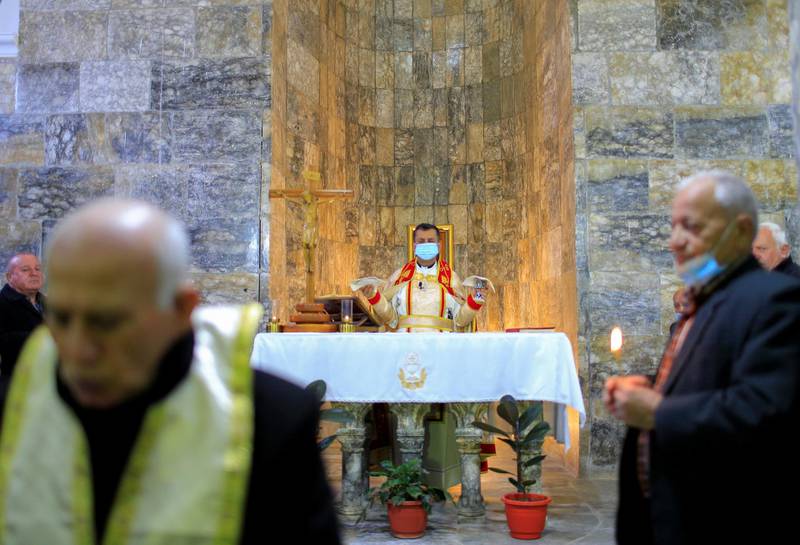 Father Ammar Altony Yako leads prayers as Christians attend mass at the Grand Immaculate Old Church in Qaraqosh, the largest church in Iraq. Pope Francis is scheduled to visit on Sunday as part of his tour. Reuters