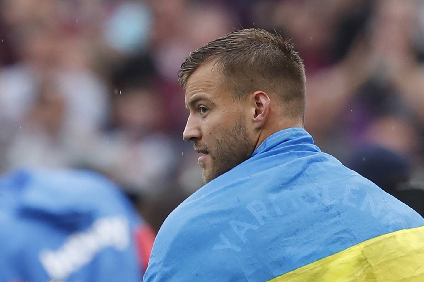 West Ham United's Ukrainian striker Andriy Yarmolenko wears the national flag after his last game. AFP 
