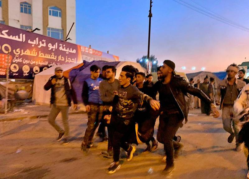 An injured protester is rushed to a hospital in Najaf, Iraq, Wednesday, February 5, 2020. AP Photo