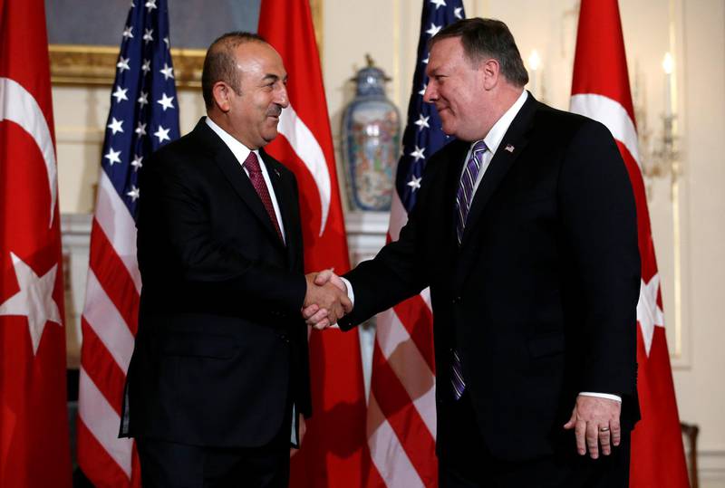 U.S. Secretary of State Mike Pompeo shakes hands with Turkish Foreign Minister Mevlut Cavusoglu at the State Department in Washington, U.S., June 4, 2018. REUTERS/ Leah Millis