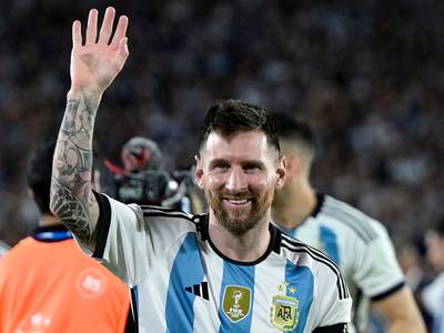 Argentina's forward Lionel Messi waves during a recognition ceremony for the World Cup winning team at the Monumental stadium in Buenos Aires Thursday. AFP