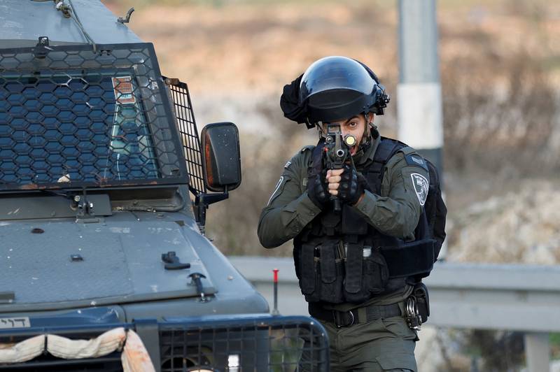 A member of the Israeli forces during a clash with Palestinians at Beit El, near Ramallah, in the Israeli-occupied West Bank on December 8. Reuters