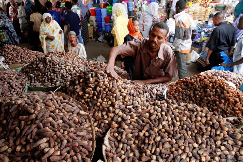 A Sudanese man prepares his shop for Ramadan shopping at a market in Khartoum, Sudan, Monday, July 8, 2013. Over a billion Muslims around the world including Sudan prepare for the holy month of Ramadan with the dawn-to-dusk fast. (AP Photo/Abd Raouf) *** Local Caption ***  Sudan Ramadan.JPEG-025c4.jpg