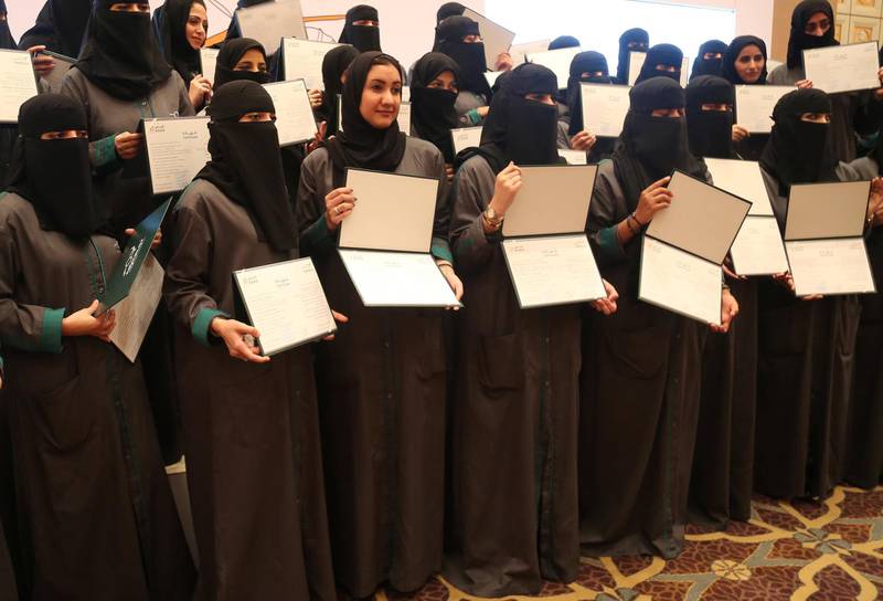 Saudi women hold their diplomas during the graduation ceremony of Saudi women car-accident inspectors, a few days before women are set to take the wheel in Riyadh, Saudi Arabia June 21, 2018. Picture taken June 21, 2018. REUTERS/Noemie Olive