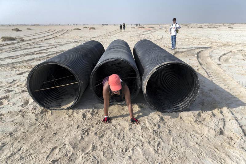 ABU DHABI, UNITED ARAB EMIRATES. 11 OCTOBER 2019. The Tough Mudder sports event held on Hudayriat Island in Abu Dhabi. The main Tough Mudder event challenged dedicated and amateur athletes with a 5km course designed to get participants moving over obstacles and along a dedicated route engineered to build team spirit. (Photo: Antonie Robertson/The National) Journalist: None. Section: National.