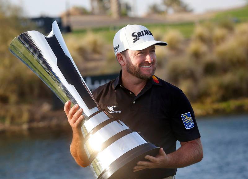 Graeme McDowell from Northern Ireland celebrates the trophy after he wins the final round of the Saudi International at Royal Greens Golf and Country Club, Sunday, Feb. 2, 2020, in Red Sea resort of King Abdullah Economic City, Saudi Arabia. (AP Photo/Amr Nabil)