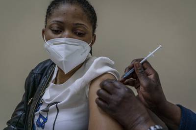 A woman is vaccinated against Covid-19 at the Hillbrow Clinic in Johannesburg, South Africa, on December 6. AP