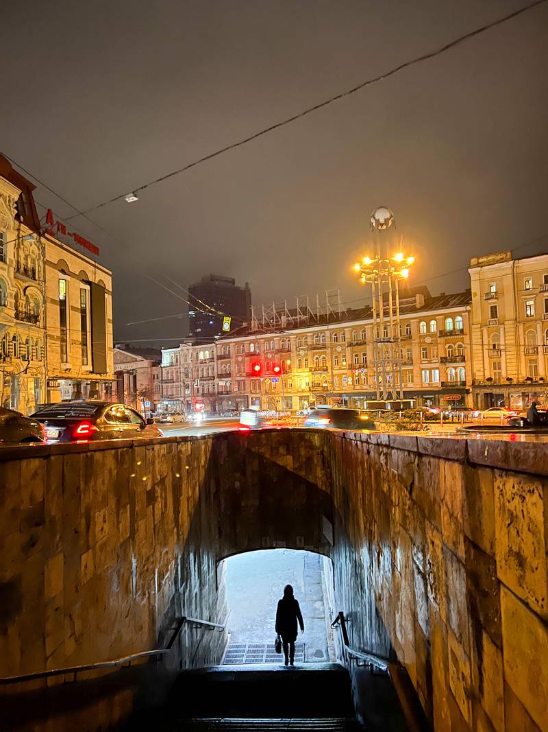 A woman walks in an underpass in Kyiv, on November 26, 2022. AFP
