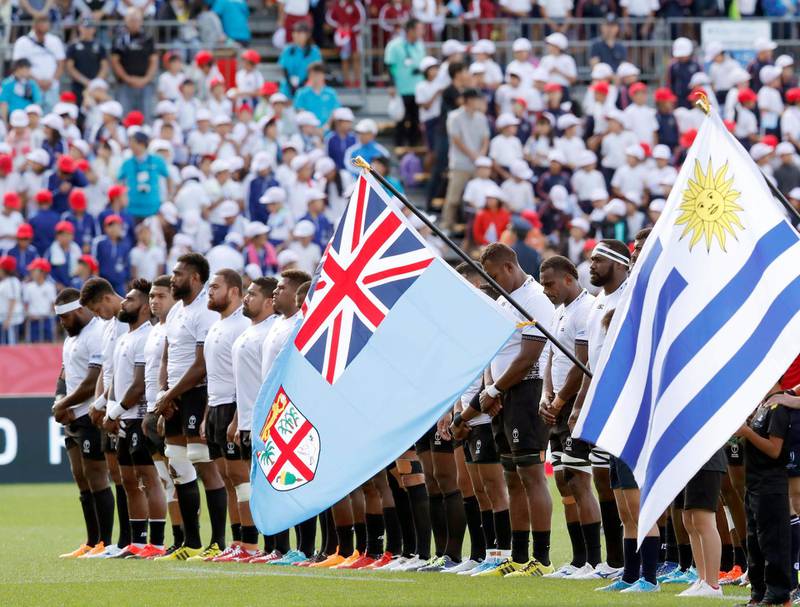 Players of Fiji, in white observe a silence of one minute for the victims of the 2011 earthquake and tsunami, ahead of a Rugby World Cup Pool D match in Kamaishi, northern Japan.  In the small fishing town, more than 1,000 were killed by the earthquake and tsunami. AP Photo