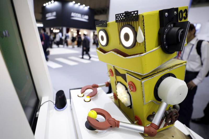 An AI Gamer 'Q56' robot plays a video game during a demonstration at the Bandai Namco Holdings Inc. booth at the Combined Exhibition of Advanced Technologies (CEATEC) in Chiba, Japan, on Wednesday, Oct. 16, 2019. CEATEC, the annual information technology and electronics trade show, will run until Oct. 18. Photographer: Kiyoshi Ota/Bloomberg