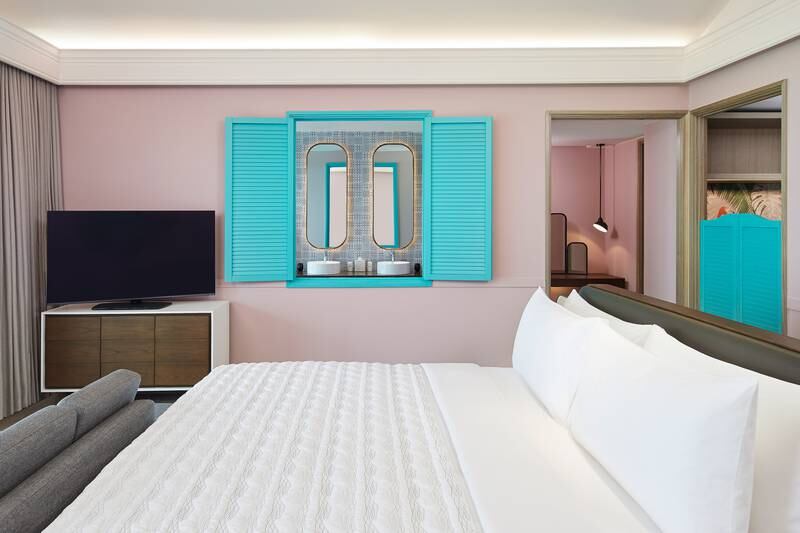 The fitting colour scheme includes pops of turquoise, mirroring the lagoon outside.