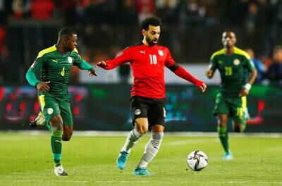 Egypt's Mohamed Salah in action with Senegal's Nampalys Mendy at the Cairo International Stadium, Cairo, Egypt on March 25, 2022. EPA