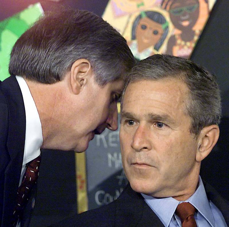 Former president George W Bush has his early morning school reading event interrupted by Chief of Staff Andrew Card on September 11, 2001. AFP