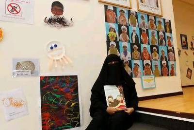 Maitha Al Khayyat with her children's book I Love My Dad's Long Beard. Jeffrey E Biteng / The National