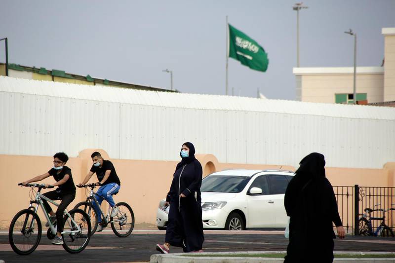 People wear face masks to protect against the spread of the coronavirus in Jeddah, Saudi Arabia. AP Photo