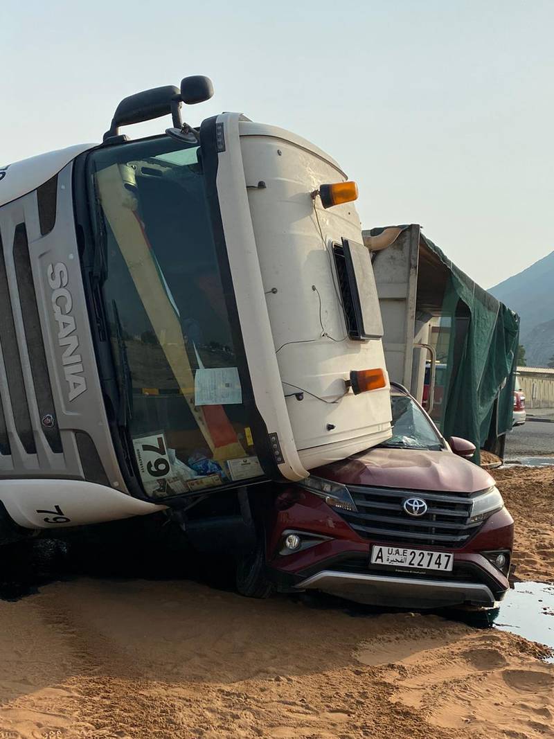 Police blamed the lorry driver after his vehicle tipped over and crushed one side of the woman's car. Fujairah Police