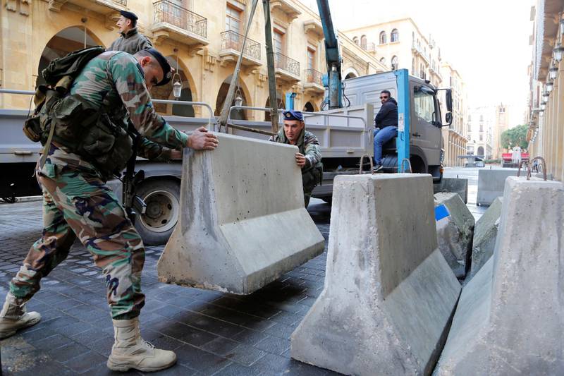 Lebanese army soldiers remove concrete blocks in downtown Beirut. The security measures had been in place around the square for a number of years, but were significantly tightened in 2015 following large-scale protests over a garbage crisis. Mohamed Azakir / Reuters