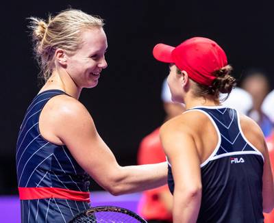Kiki Bertens, left, is congratulated by Ashleigh Barty after winning their group stage match at the WTA Finals in Shenzhen.  EPA