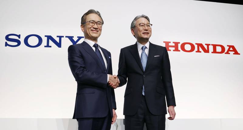 Sony Group chief executive Kenichiro Yoshida and Honda Motor chief executive Toshihiro Mibe announce the partnership to develop electric vehicles, in Tokyo. AP