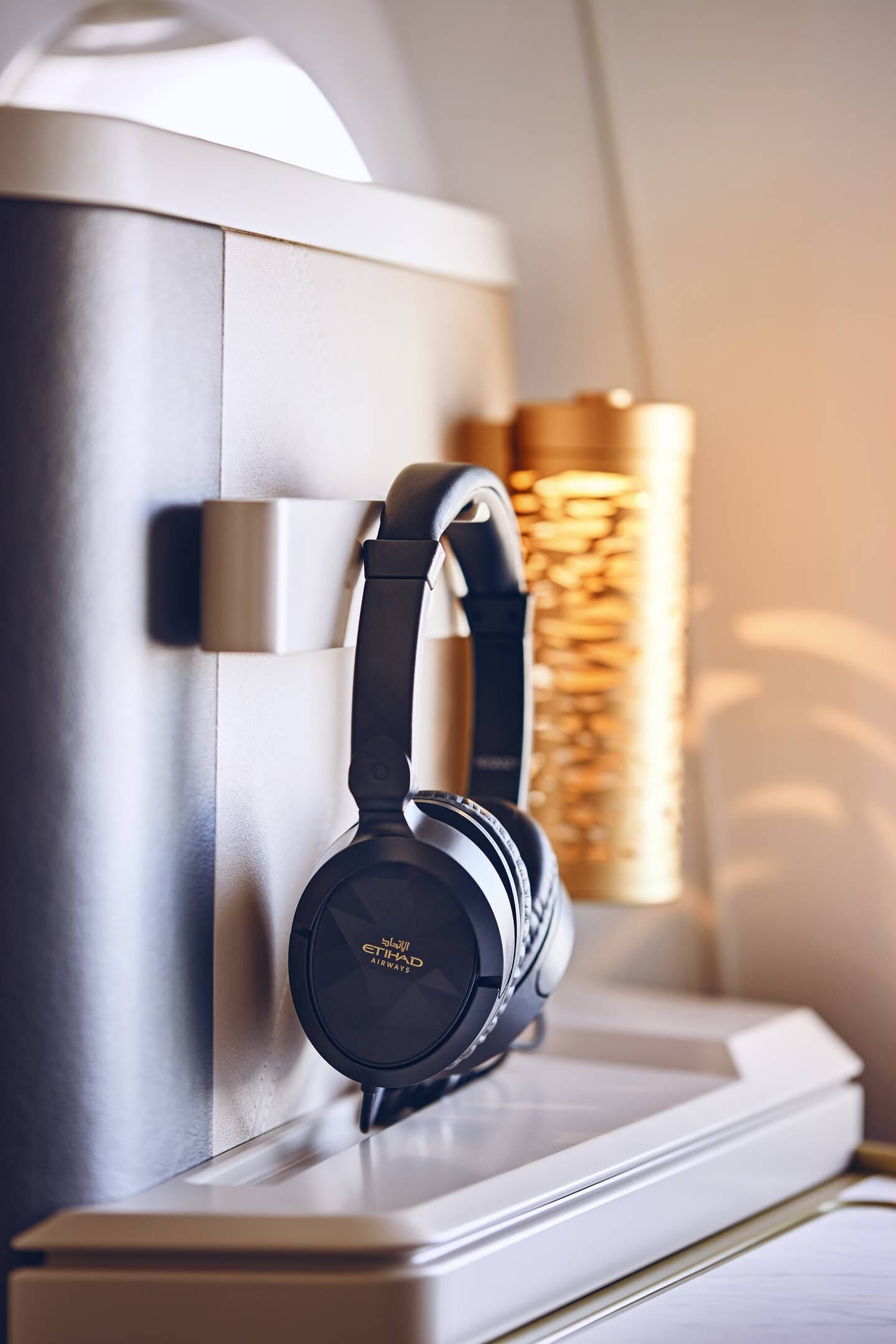 Details like noise-cancelling headphones and palm-tree inspired lighting columns offer a sense of luxury. Photo: Etihad