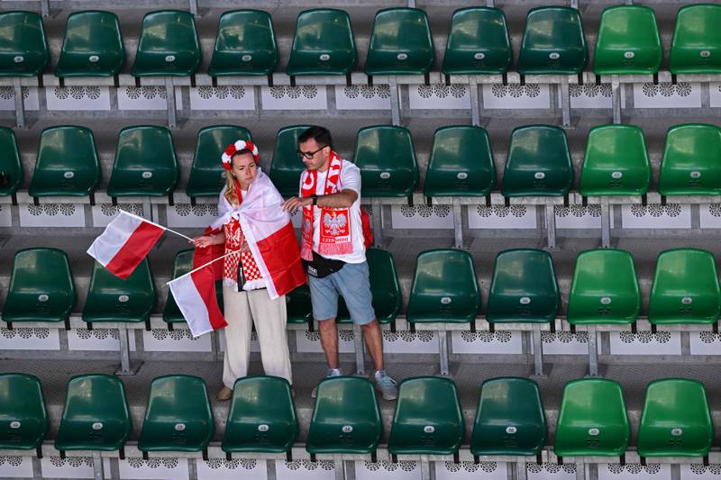 Poland supporters are still waiting for their team's first win at these finals. AFP