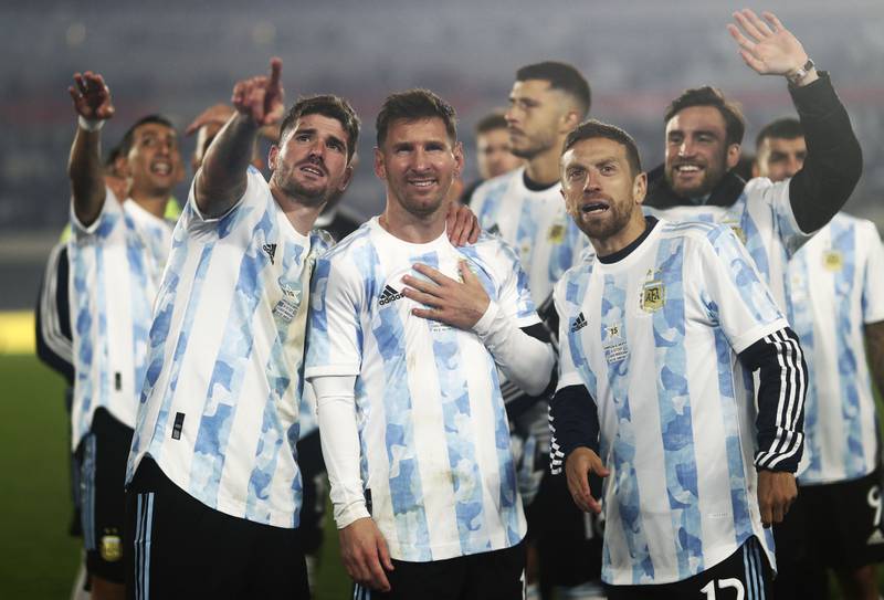 Lionel Messi celebrates with Argentina teammates after the match. AP
