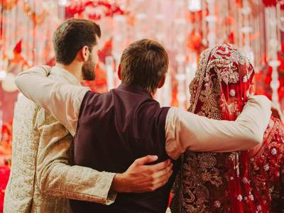 Shahid Afridi, centre, with his daughter Ansha Afridi and son-in-law Shaheen Shah Afridi during the couple's wedding ceremony in Karachi. Photo: X/@SAfridiOfficial