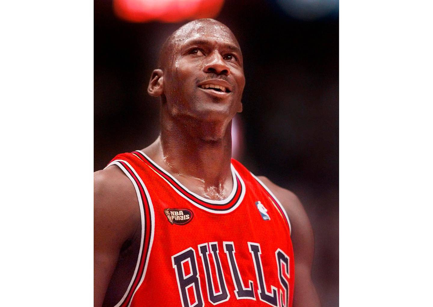 FILE -This June 14, 1998 file photo shows Chicago Bulls' Michael Jordan looking up at the score during the third quarter of their NBA Finals game against the Utah Jazz in Salt Lake City. â€œThe Last Dance,â€ ESPNâ€™s docuseries detailing the 1998 and final season of the Chicago Bulls championship dynasty, has served as a reminder to basketball fans of the greatness of Michael Jordan on the court. It also shed light on his worldwide marketing allure. (AP Photo/Mark J. Terrill, File)