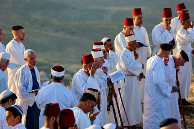 Samaritan worshippers gather to pray at sunrise during a Passover ceremony on top of Mount Gerizim, near the northern West Bank town of Nablus. AFP