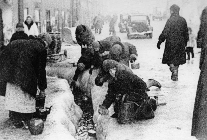 In the winter of 1942, citizens of Leningrad dig up water from a broken main, during the 900-day siege of the Russian city by German invaders. AP