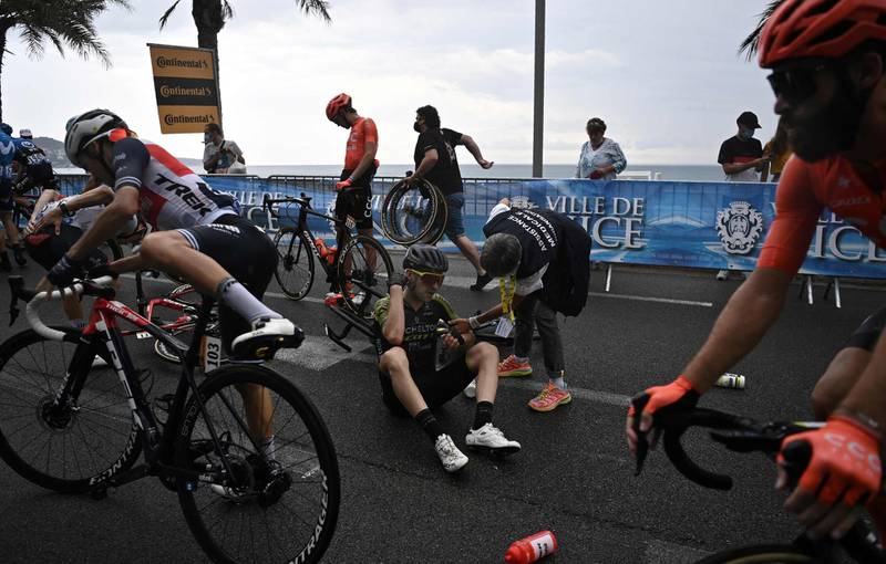 Team Mitchelton rider Mikel Nieve sits on the road after crashing. AFP