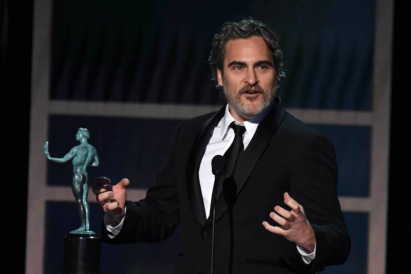 US actor Joaquin Phoenix accepts the award for Outstanding Performance by a Male Actor in a Leading Role during the 26th Annual Screen Actors Guild Awards show at the Shrine Auditorium in Los Angeles on January 19, 2020. / AFP / Robyn Beck
