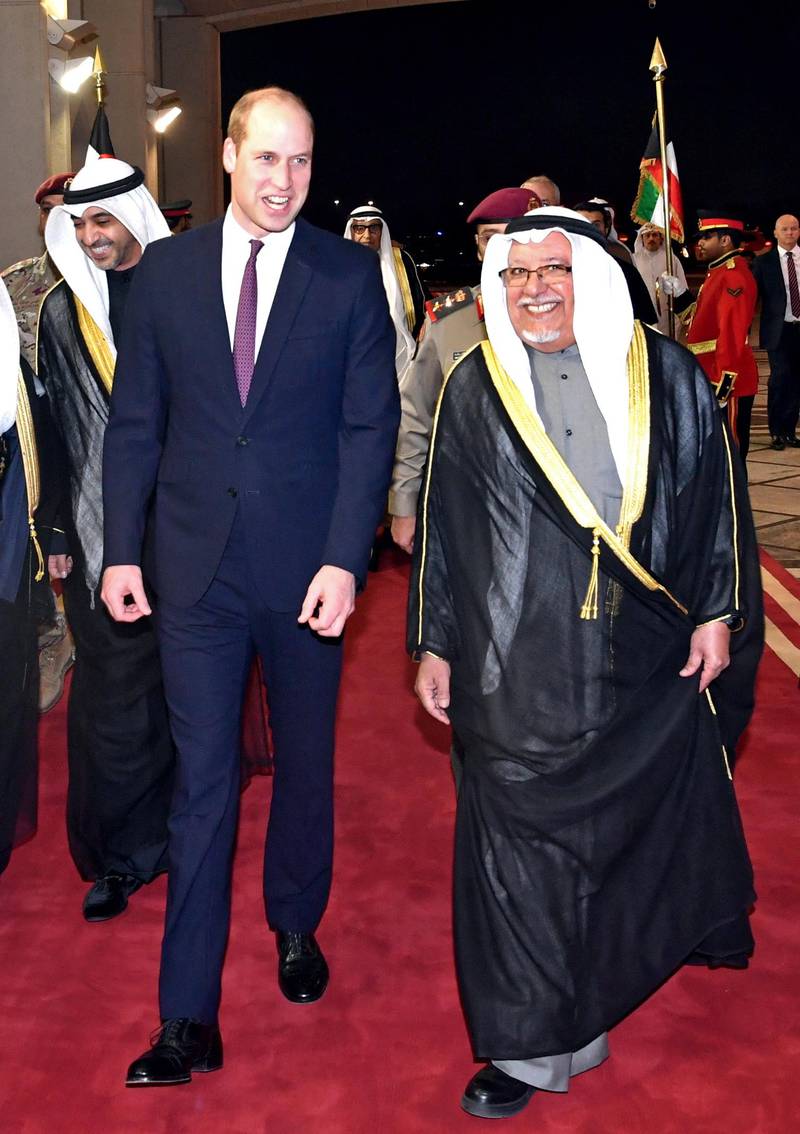 Britain's Prince William, the Duke of Cambridge, is received by Kuwait's Minister of the Amiri Diwan (Royal Palace) Affairs, Sheikh Ali al-Jarrah al-Sabah, at Kuwait International Airport.  EPA