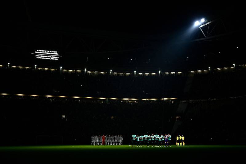 Juventus Turin's players (L) and Maccabi Haifa's players stand on the pitch during a minute of silence, after Indonesia's stadium tragedy, prior to the start of the UEFA Champions League 1st round day 3 group H football match between, at the Juventus stadium in Turin, Italy on October 5. AFP