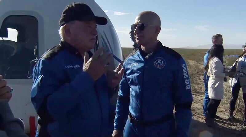 William Shatner, who at 90 years of age became the oldest person to travel to space, discusses the suborbital flight with Jeff Bezos. EPA